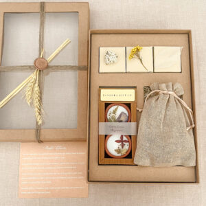 Rustic gift box with candles, dry flowers, treats & jute pouch