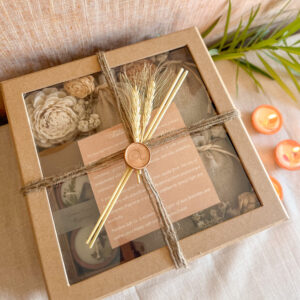Festive eco gift box with dried flowers, candles & jute pouches.