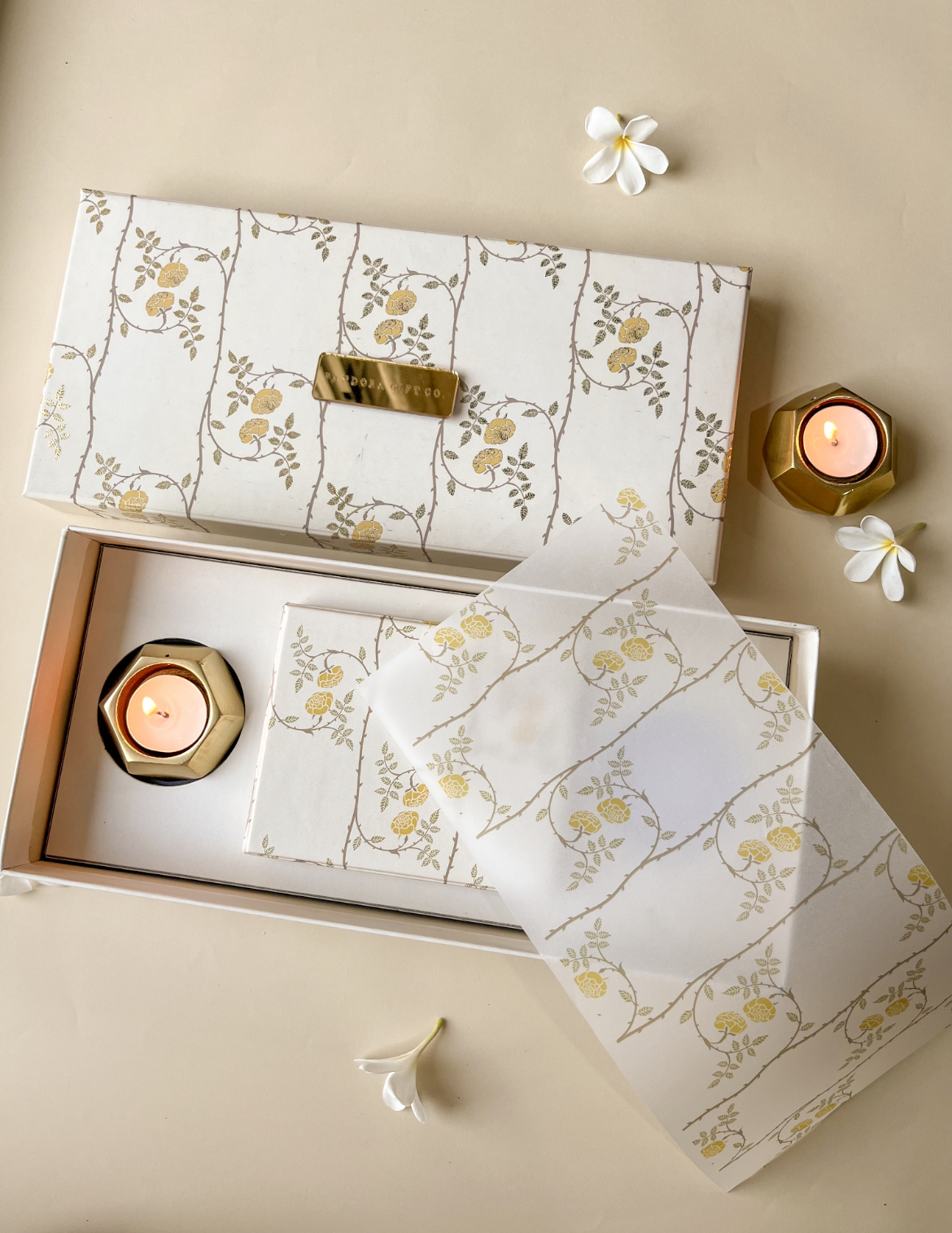 Luminous gift box with gold florals, luxe candle & elegant packaging