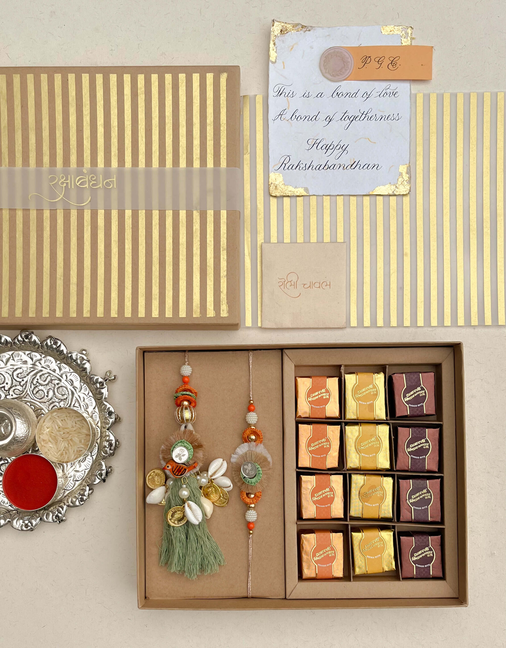 Sparrow Rakhi Lumba Gift Box with Roli Chawal and Assorted Sweets for Rakshabandhan by Pandora Gift Co